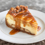 Perfect caramel apple cheesecake with golden caramel drizzle and cinnamon apples on rustic wooden stand