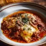 Crockpot Ravioli Lasagna served with fresh herbs