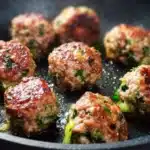 Plate of easy low carb high protein turkey meatballs garnished with herbs