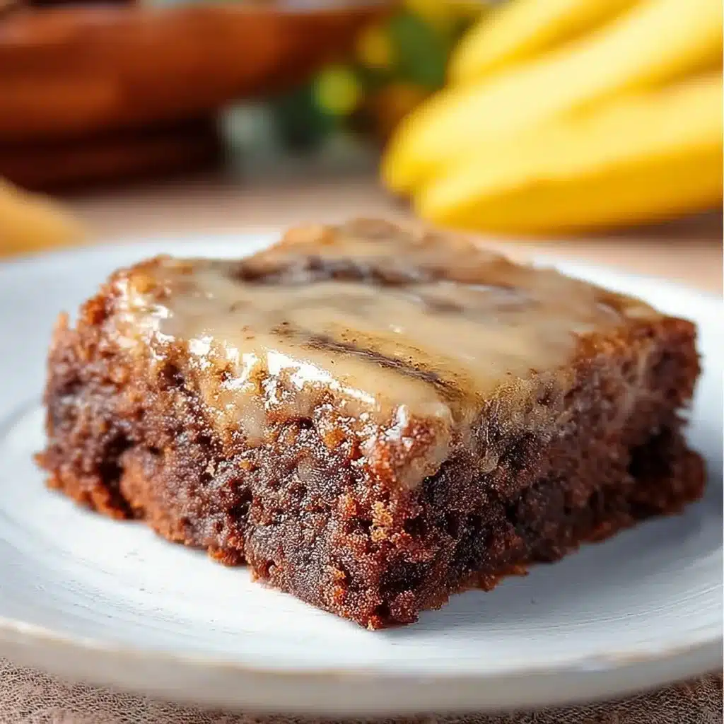 Delicious banana bread brownies served on a plate with chocolate drizzle