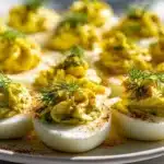 Delicious dill pickle deviled eggs on a serving platter